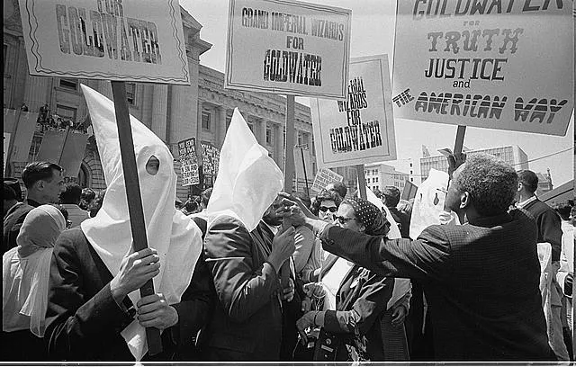 [Civil rights activists dressed up as Ku Klux Klan members to protest racists supporting the presidential campaign of Barry Goldwater at the Republican National Convention, San Francisco, California]
