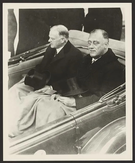 [Franklin Delano Roosevelt and Herbert Hoover in convertible automobile on way to U.S. Capitol for Roosevelt's inauguration, March 4, 1933]