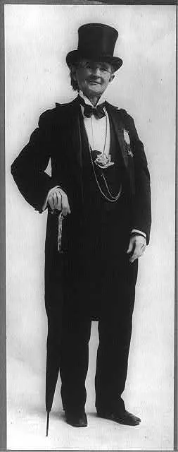 [Mary Edwards Walker, 1832-1919, full length portrait, standing, facing slightly right; holding umbrella; in top hat and tails. 1st woman Army medical officer (Civil War); suffragette and dress reformer]