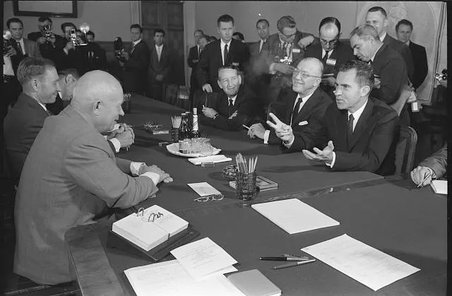 [Vice President Richard Nixon, Dr. Milton Eisenhower and U.S. Ambassador to the Soviet Union Llewellyn E. Thompson Jr., seated across table from Soviet leader Nikita Khrushchev in his office, Moscow, Soviet Union]
