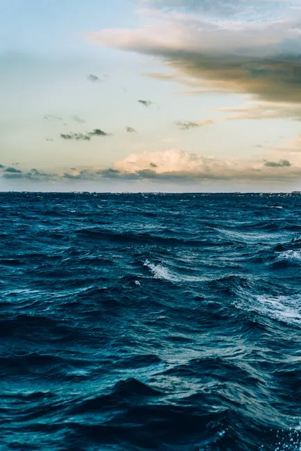 A captivating view of ocean waves under a dramatic twilight sky, offering a peaceful seascape.