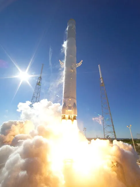A powerful rocket takes off into a clear blue sky, surrounded by clouds of smoke.