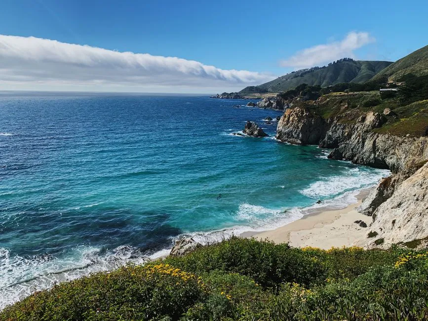 Breathtaking view of cliffs and ocean at Big Sur, California's coastline.