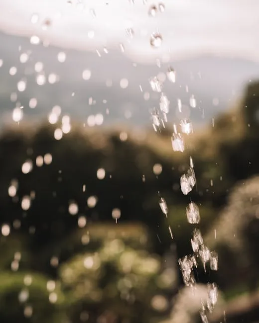 Captivating shot of water droplets falling with a scenic nature view in Stresa, Italy.