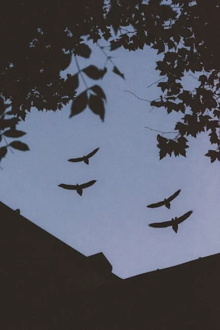 Dark silhouettes of birds against a twilight sky, surrounded by tree leaves.