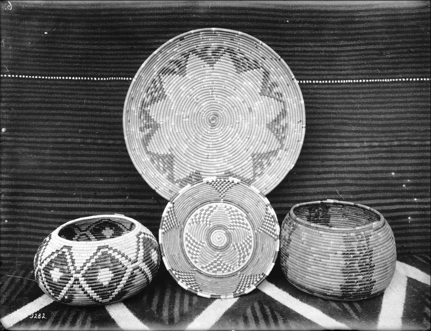 Four Indian baskets on display, ca.1900 (CHS-3282)