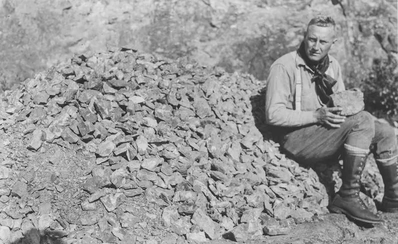 Gilbert Labine examining uranium ore at the Eldorado Mine located at Great Bear Lake, Northwest Territories