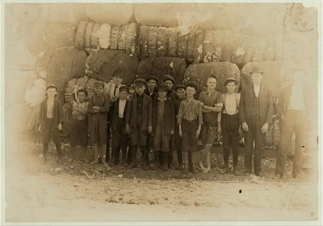 Group of boys working in Lancaster S.C. Cotton mills. Smallest boy said he had worked in the mill off and on for five years. Spins now.  Location: Lancaster, South Carolina.