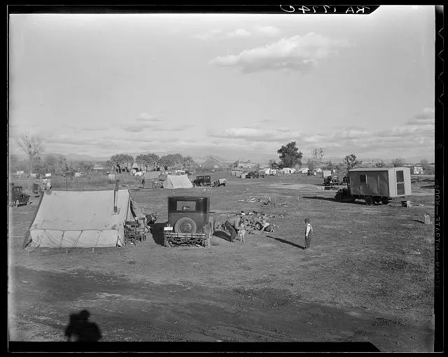 Hooverville of Bakersfield, California. A rapidly growing community of people living rent-free on the edge of the town dump in whatever kind of shelter available. Approximately one thousand people now living here and raising children