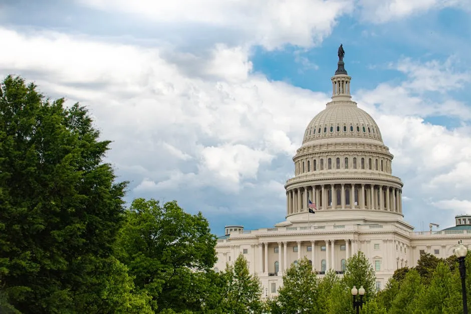 Iconic view of the U.S. Capitol building surrounded by lush trees in Washington D.C.