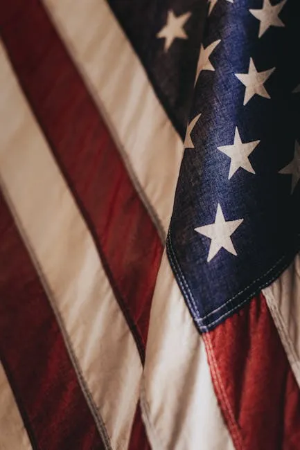 Patriotic close-up of the United States flag showcasing the stars and stripes pattern.