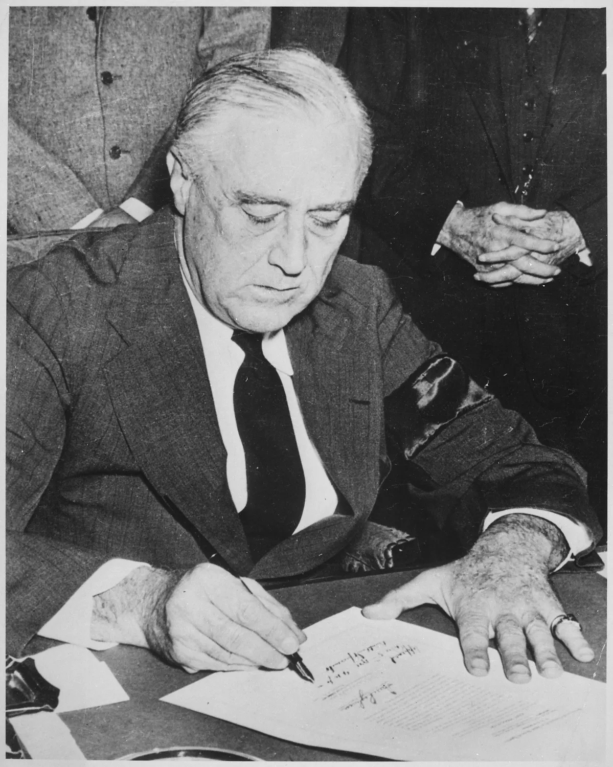 Photograph of President Franklin D. Roosevelt Signing the Declaration of War Against Japan, 12-08-1941 - NARA - 520053