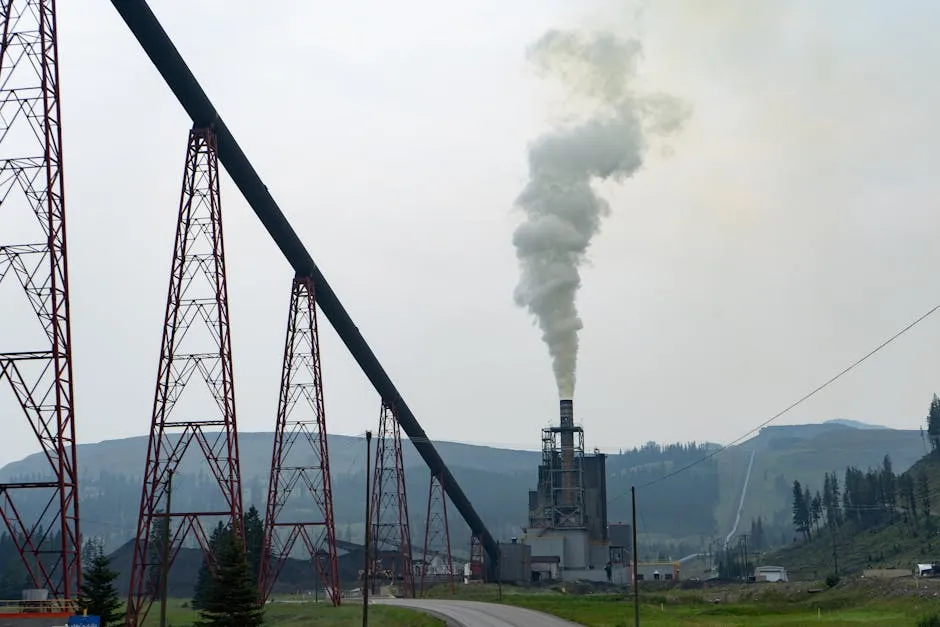 Smoke emitting from a factory stack in Elkford, BC, illustrating air pollution.