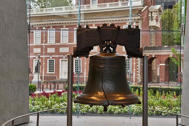 The Liberty Bell at Independence National Historical Park, a U.S. national park in Philadelphia, Pennsylvania, that preserves several sites associated with the American Revolution and the nation's founding history. The bell, with its iconic crack, hung in the Pennsylvania State House (now called Independence Hall) for more than 90 years before being moved to its own, modern visitor center. The bell was cast in 1752 with a message: 