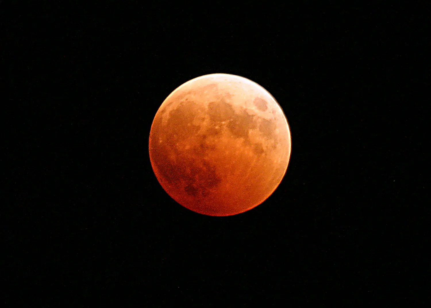 US Navy 041027-N-9500T-001 The moon turns red and orange during a total lunar eclipse