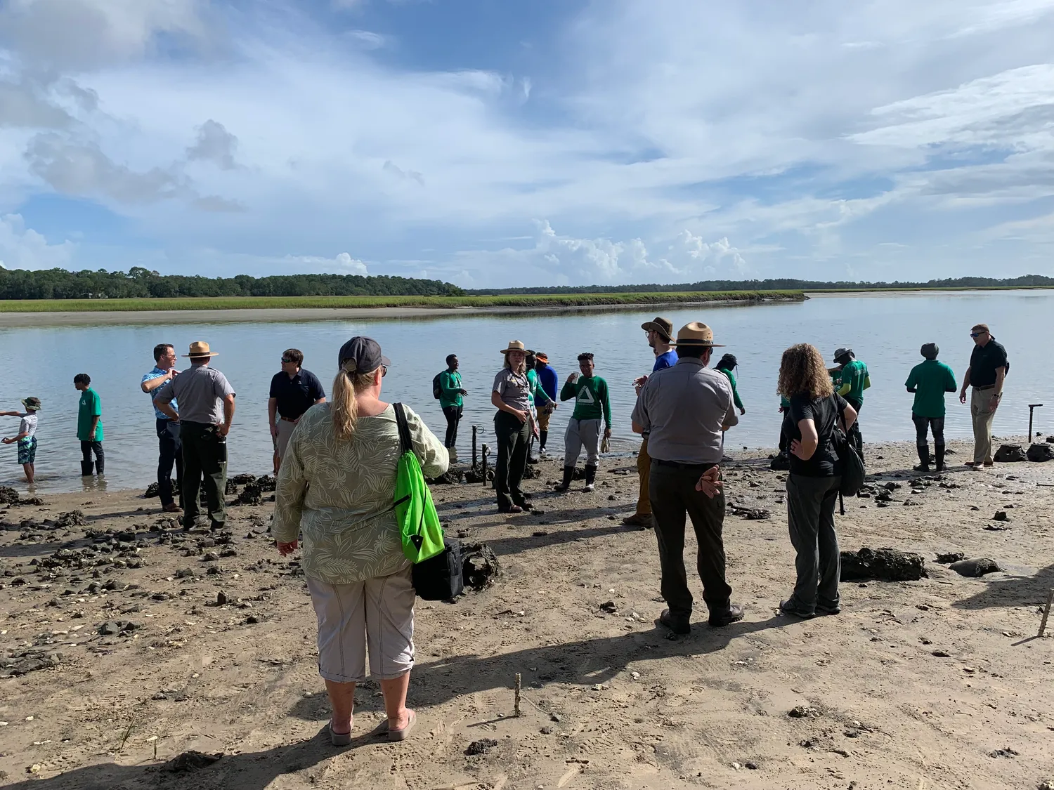 Volunteers help in shoreline restoration by planting and monitoring grasses and installing oyster structures. (cd6e4360-f4f5-4ab1-b0dc-93adaab363b2)