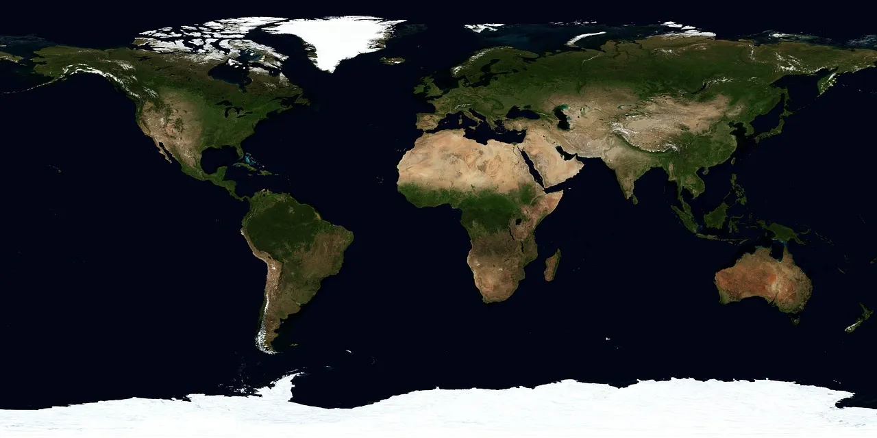 Satellite world map showing green and brown continents across dark blue oceans.